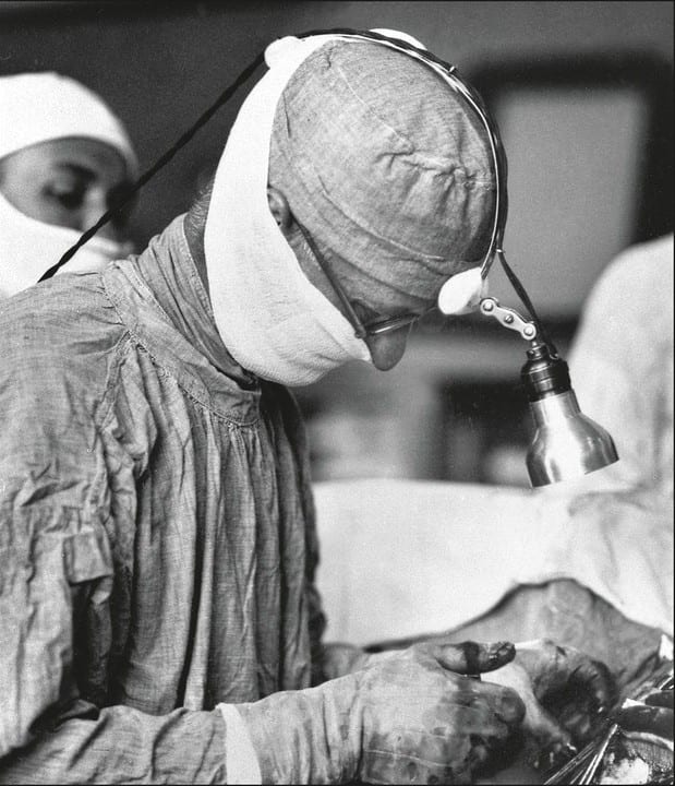 Harvey Cushing operating, with headlamp